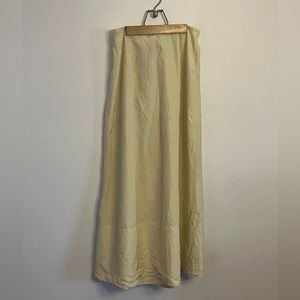 Pale lemon yellow skirt with small bustle